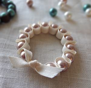 Pink Pearls Set in a Folded Ribbon Bracelet