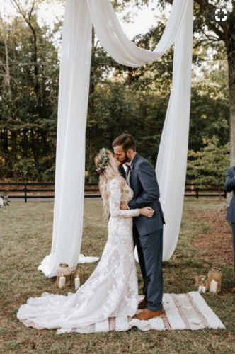 Bride & Groom Kissing at the Alter