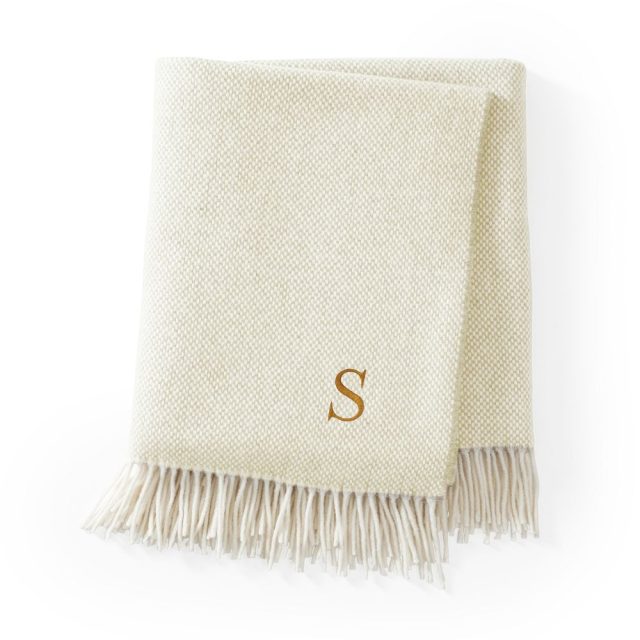 Cashmere throw rug monogrammed with the letter S.