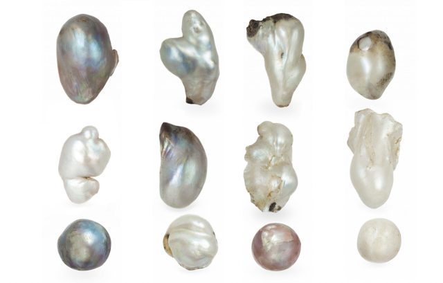 Twelve loose baroque pearls in a range of irregular shapes and colors, from freeform and wing-shaped to more rounded examples in white, cream, gray and pink tones.
